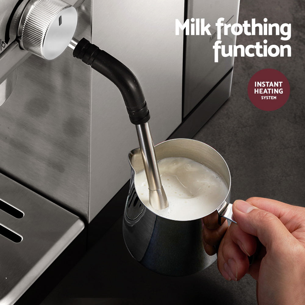 Hand using Devanti 20 Bar Coffee Machine with milk frothing function and instant heating for perfect coffee preparation.