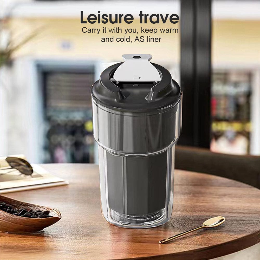 Black double wall insulated coffee cup on table, ideal for keeping beverages hot or cold, with a leak-proof and reusable design.