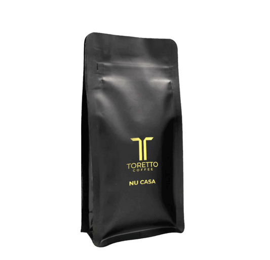 Coffee bag of Nu Casa with creamy milk chocolate and hazelnut flavor, perfect for espresso and milk-based coffee lovers.